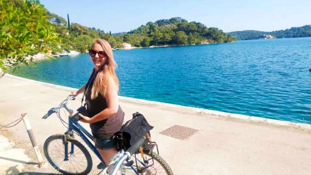 The author Taylor Herperger, posing on her bike at Mljet Island