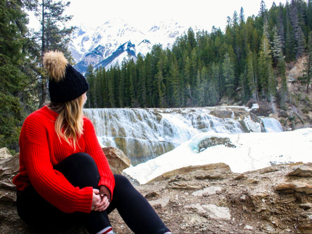 Author Taylor looking at the falls in Yoho National Park