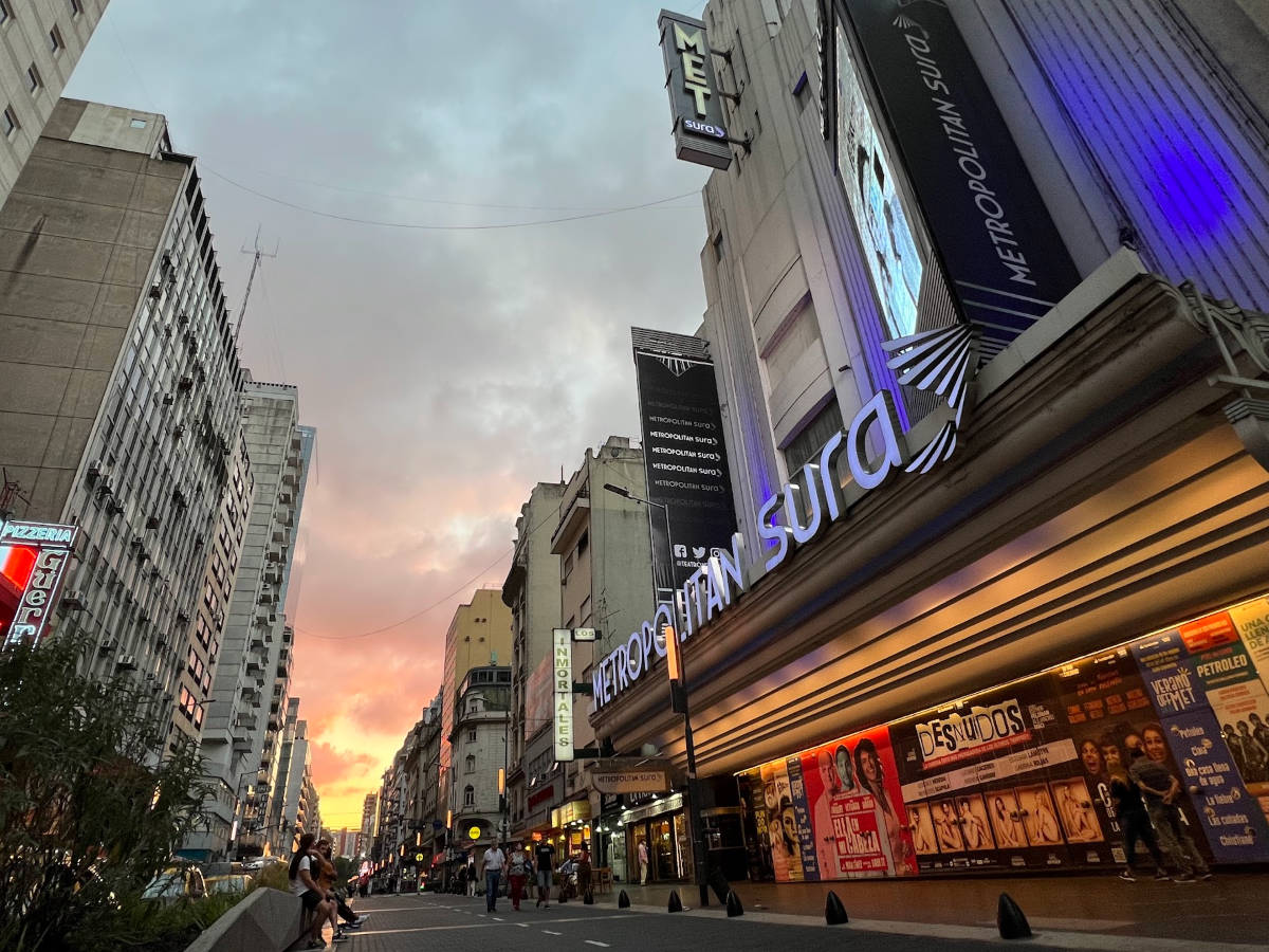 View of the neon signs along the historic theaters in Avenida Corrientes at sunset