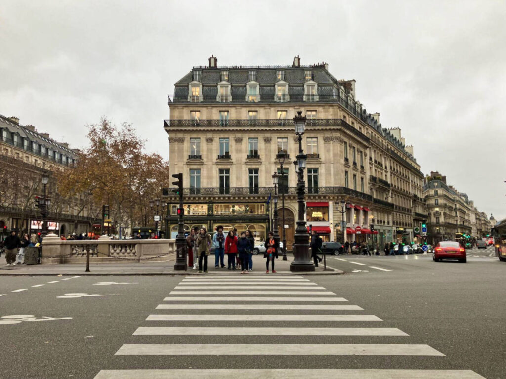 People at the pedestrian lane in front of the grand Avenue de l’Opéra