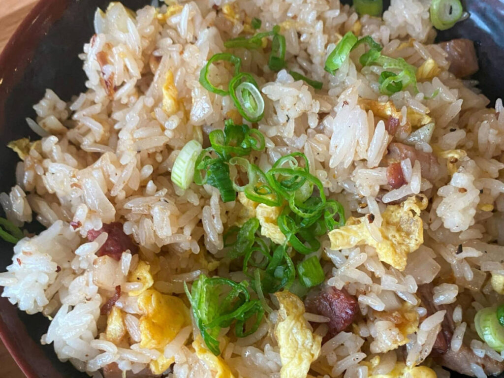 Close up view of BBQ brisket fried rice at The Blind Goat