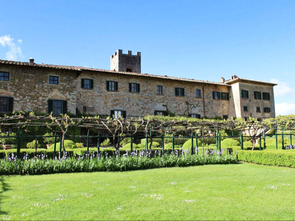 Exterior view of Badia a Coltibuono Wine Resort surrounded by vineyard