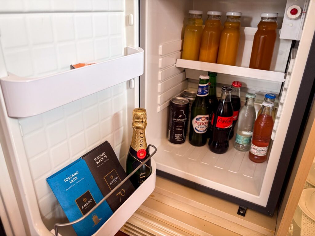 Drinks and chocolates inside the Baglioni Hotel Luna in-room mini fridge
