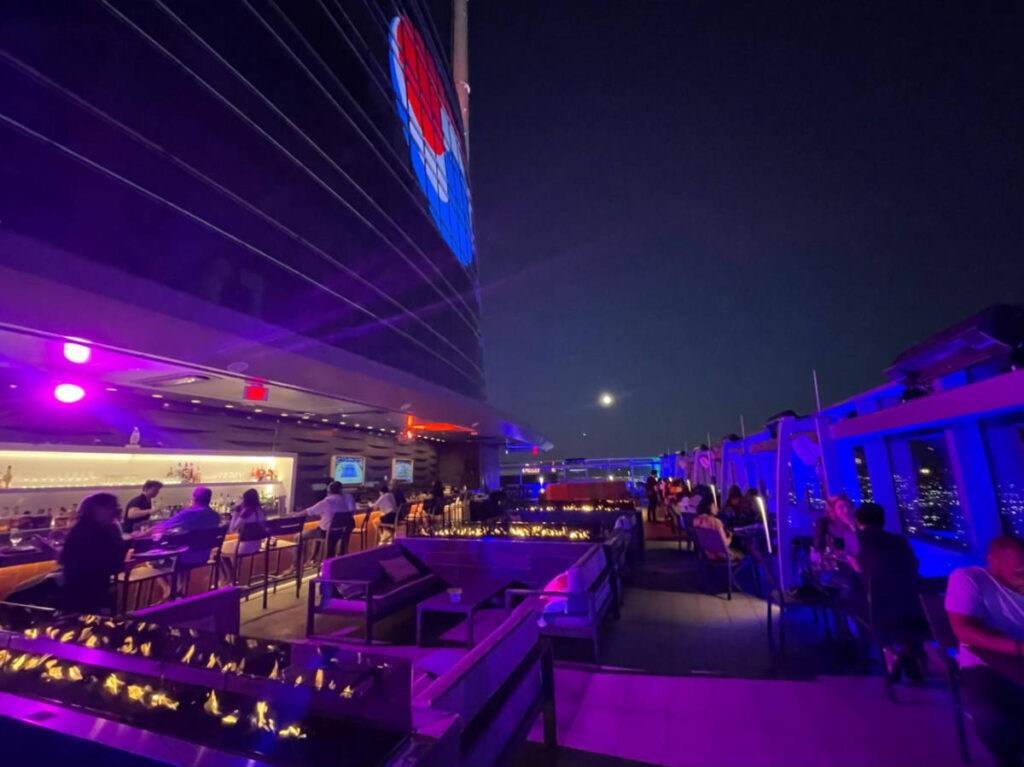 View of the neon lights at the rooftop bar of Spire 73