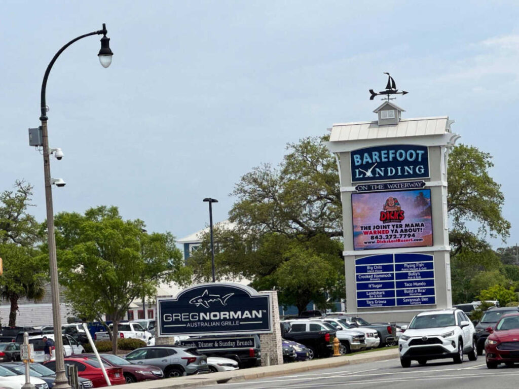 View of the signage of Barefoot Landing at the parking area