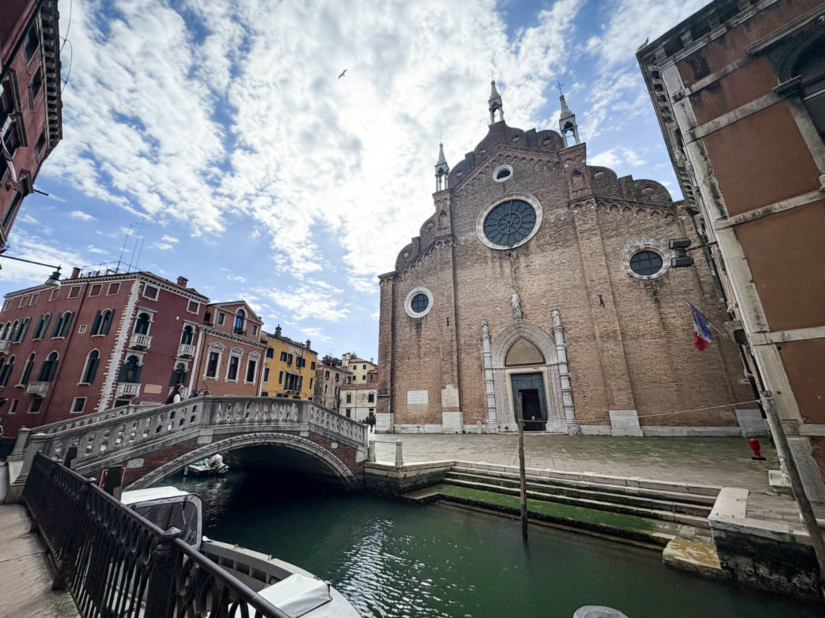 Facade of the Basilica S.Maria Gloriosa dei Frari seen from across the canal
