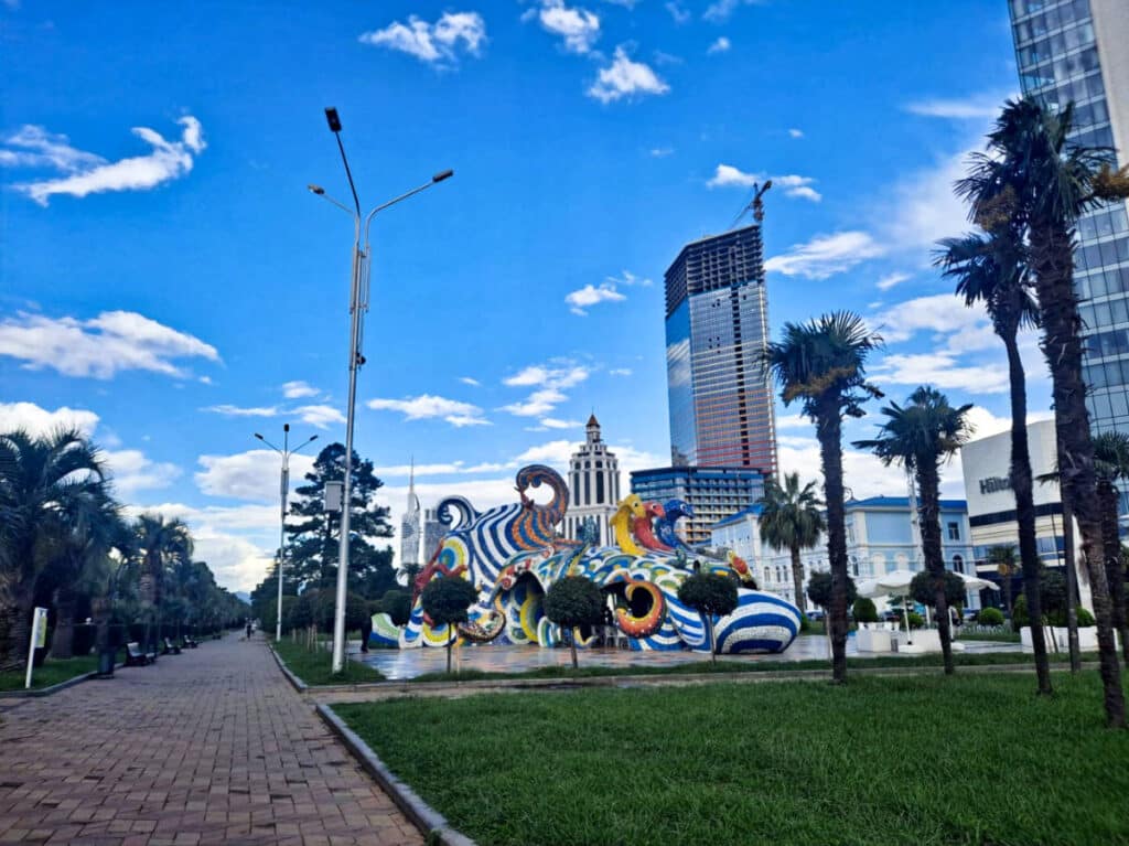 View of the colorful exterior of Batumi Octopus and Soviet Mosaics from a distance