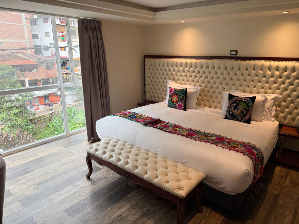 View of the bed on a room in Jaya Machu Picchu Boutique Hotel