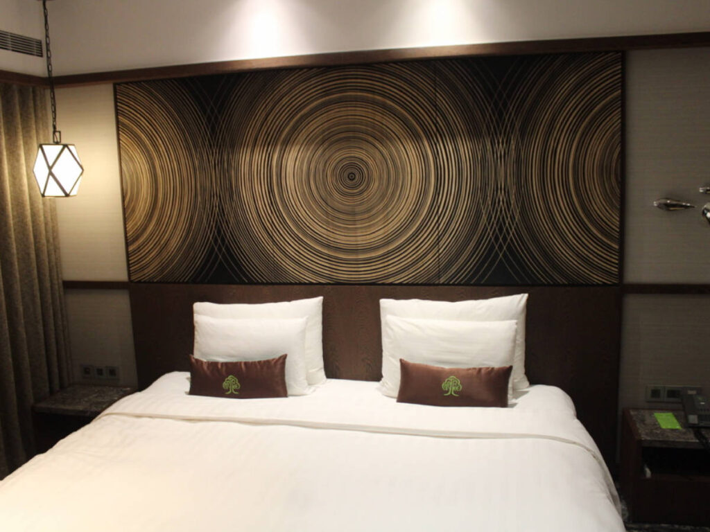 View of the bed in a room in arTree Hotel