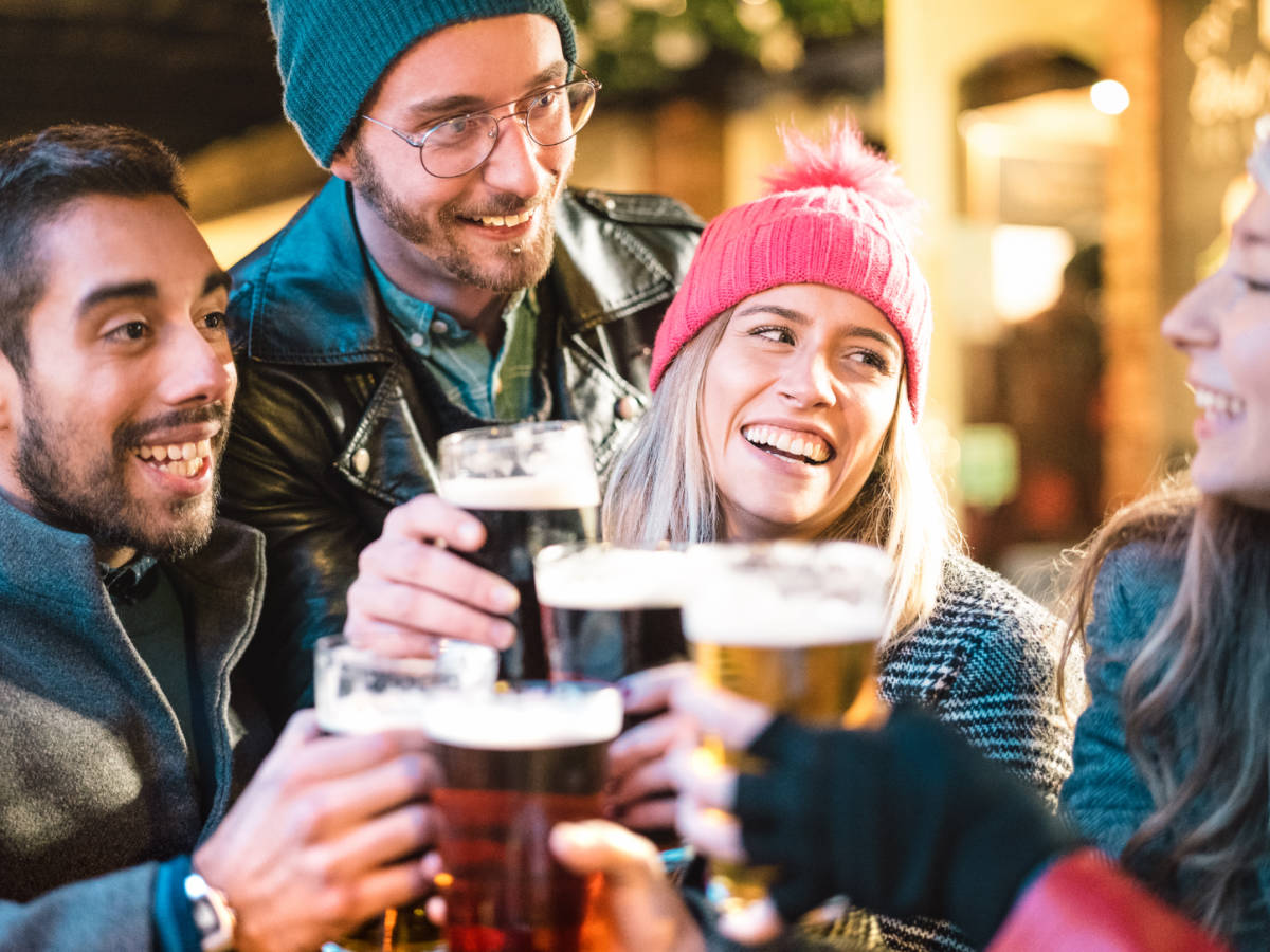A group of friends enjoying their beer at the Mittenfest