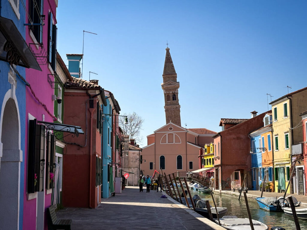 View of the colorful buildings and the leaning bell tower of Burano