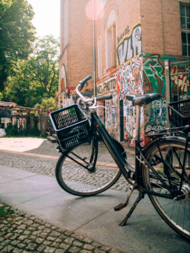 A rental bike near a mural