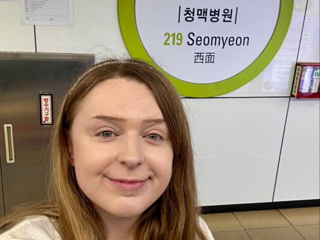 The author Bethan Nutting, smiling for a photo at the Seomyeon Station