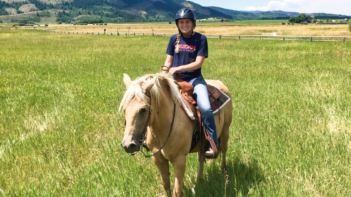 A woman horse back riding in Jackson Hole