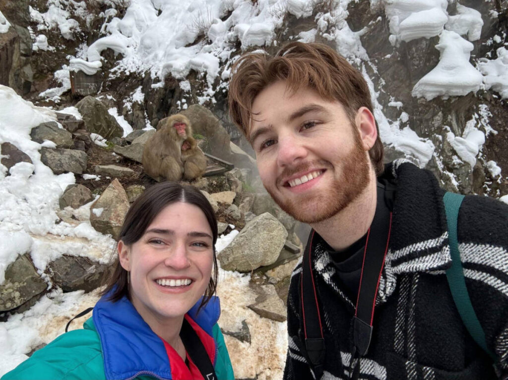 The author, Betty Hurd with her partner taking a selfie with the Japanese snow monkeys