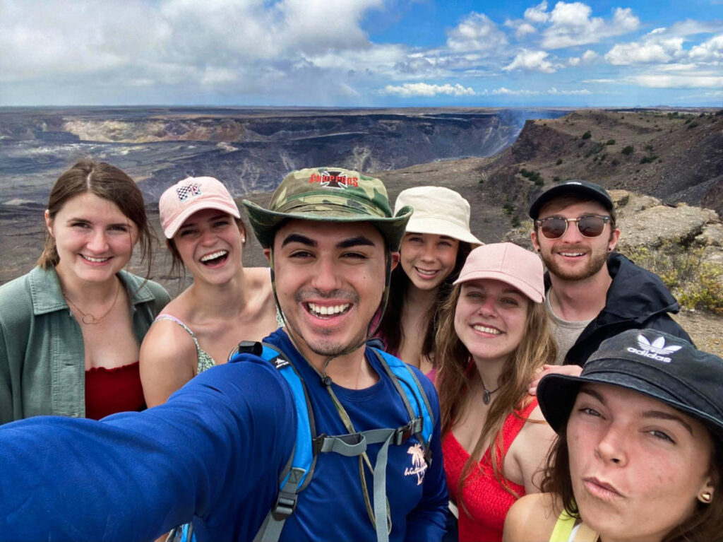 AA group of friends smiling for a photo at the trail