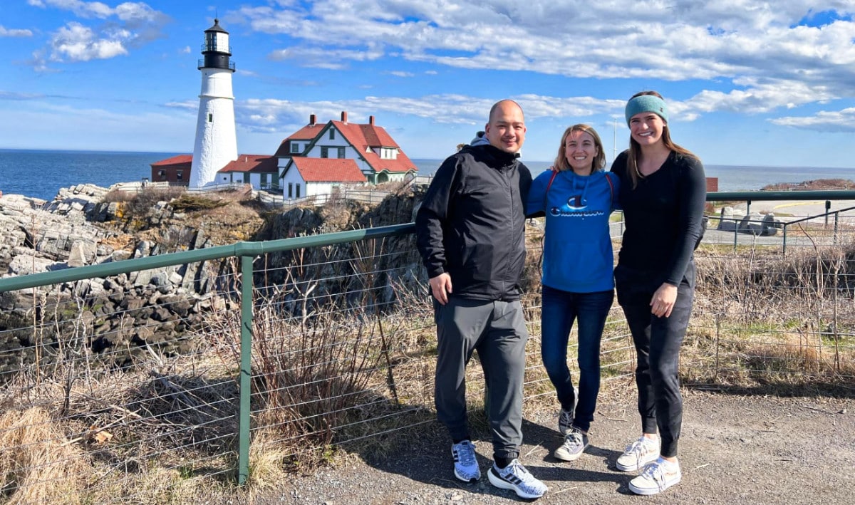 Travel Lemming Writer, Betty and her friends posed with the lighthouse in the background in Portland