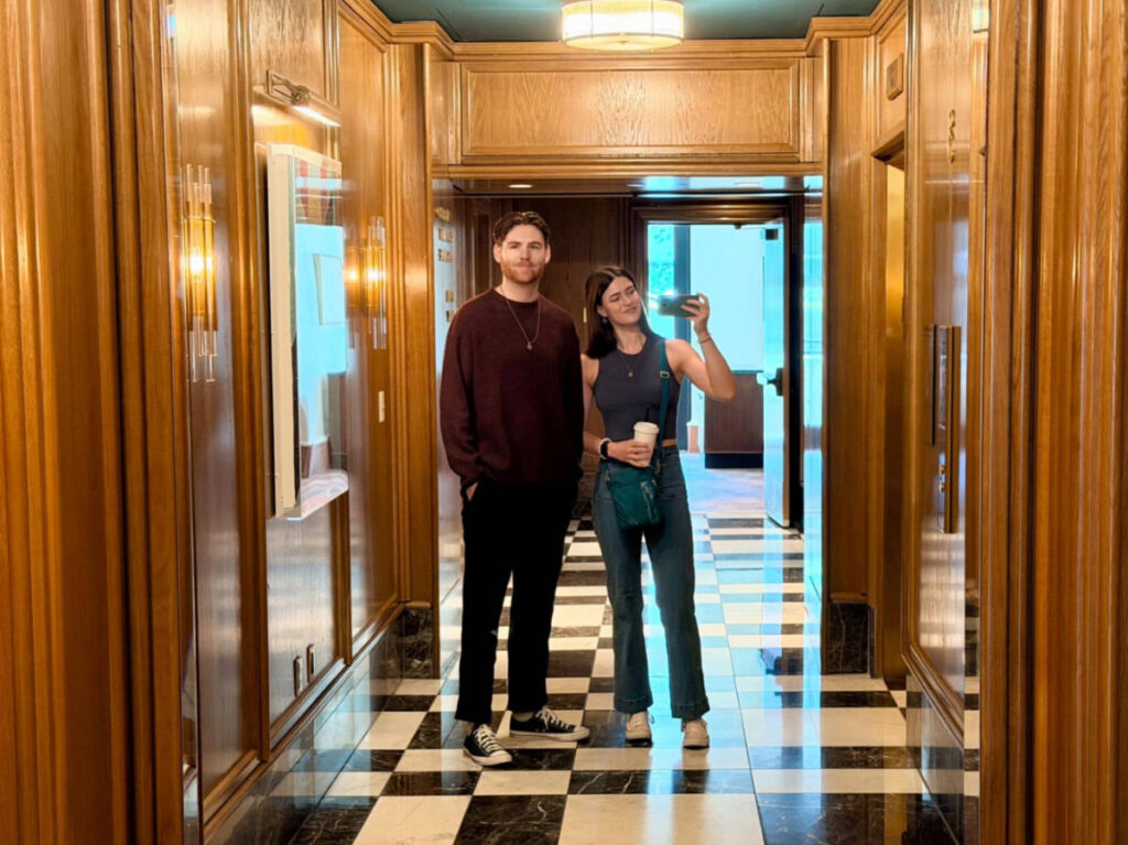 The author Betty Hurd and her boyfriend, Michael, taking a photo through the mirror in the hallway of Sun Rose