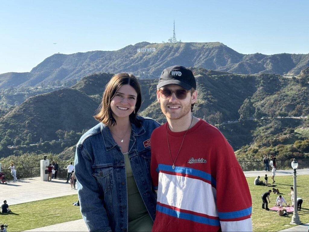Author Betty and Michael with the Hollywood Sign in the background