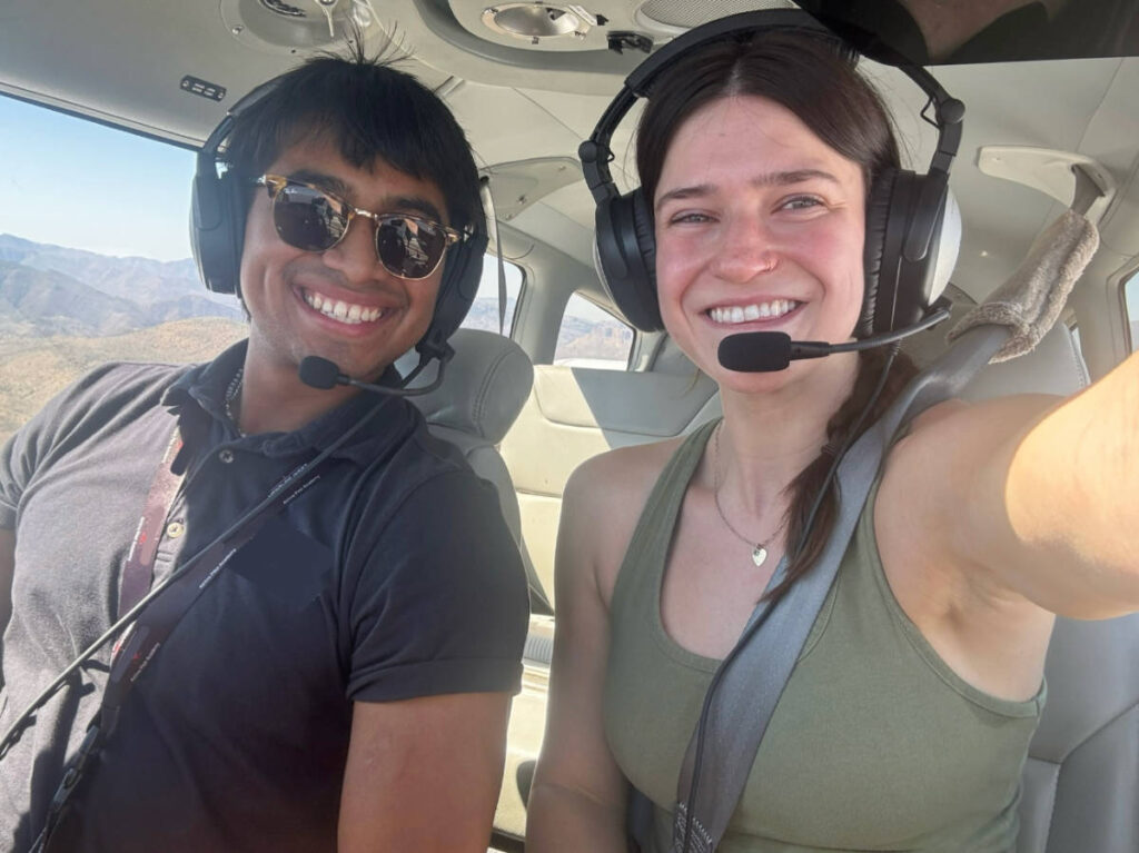 The author Betty Hurd taking a selfie with a flight instructor