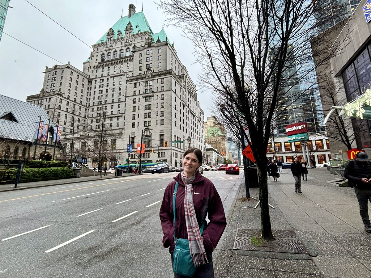 Travel Lemming writer Betty Hurd, smiling for a photo in front of the Fairmont Hotel Vancouver