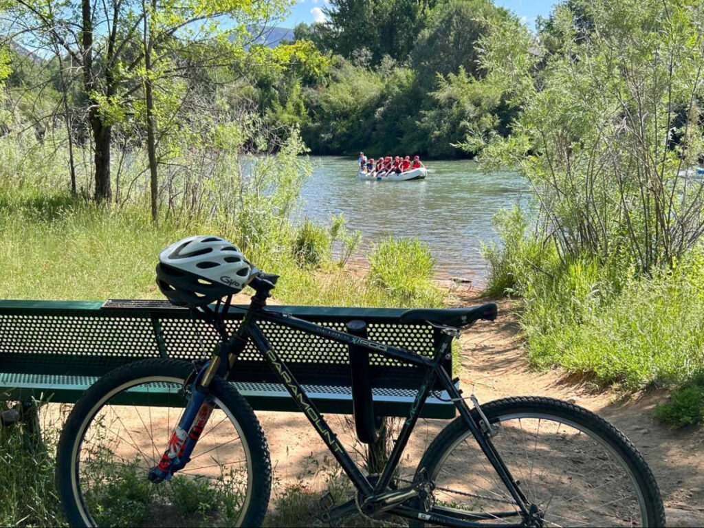 View of the bike behind the bench at the Animas River Trail