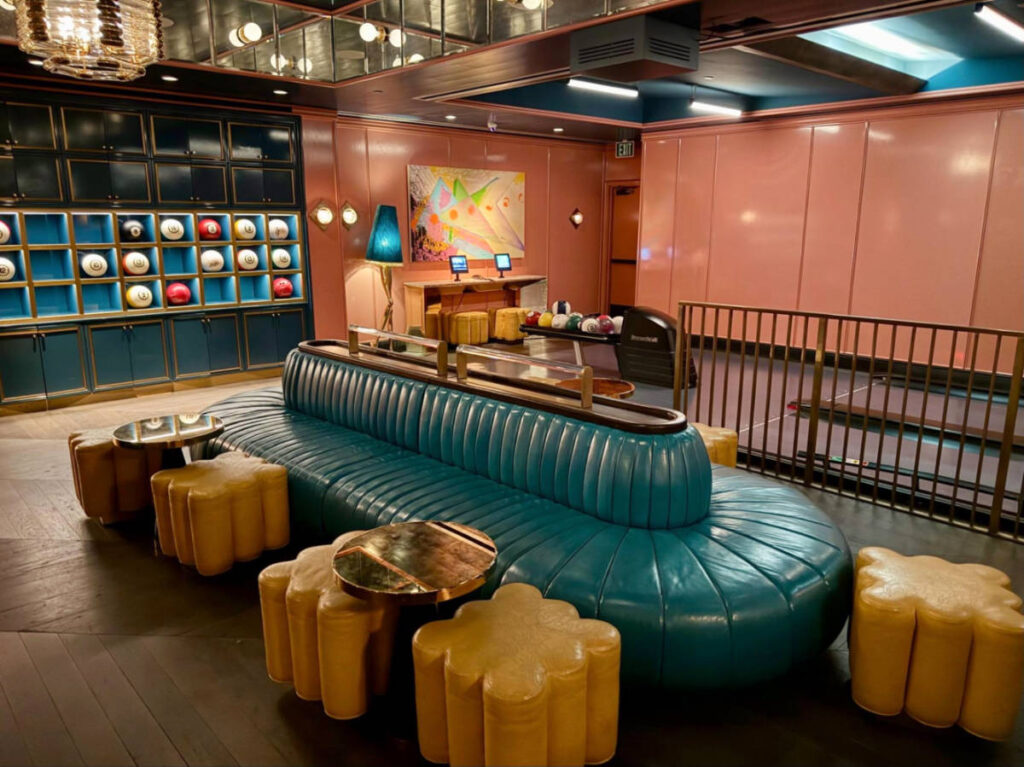 View of the billiards-themed bowling balls on the wall and the chic retro interior
