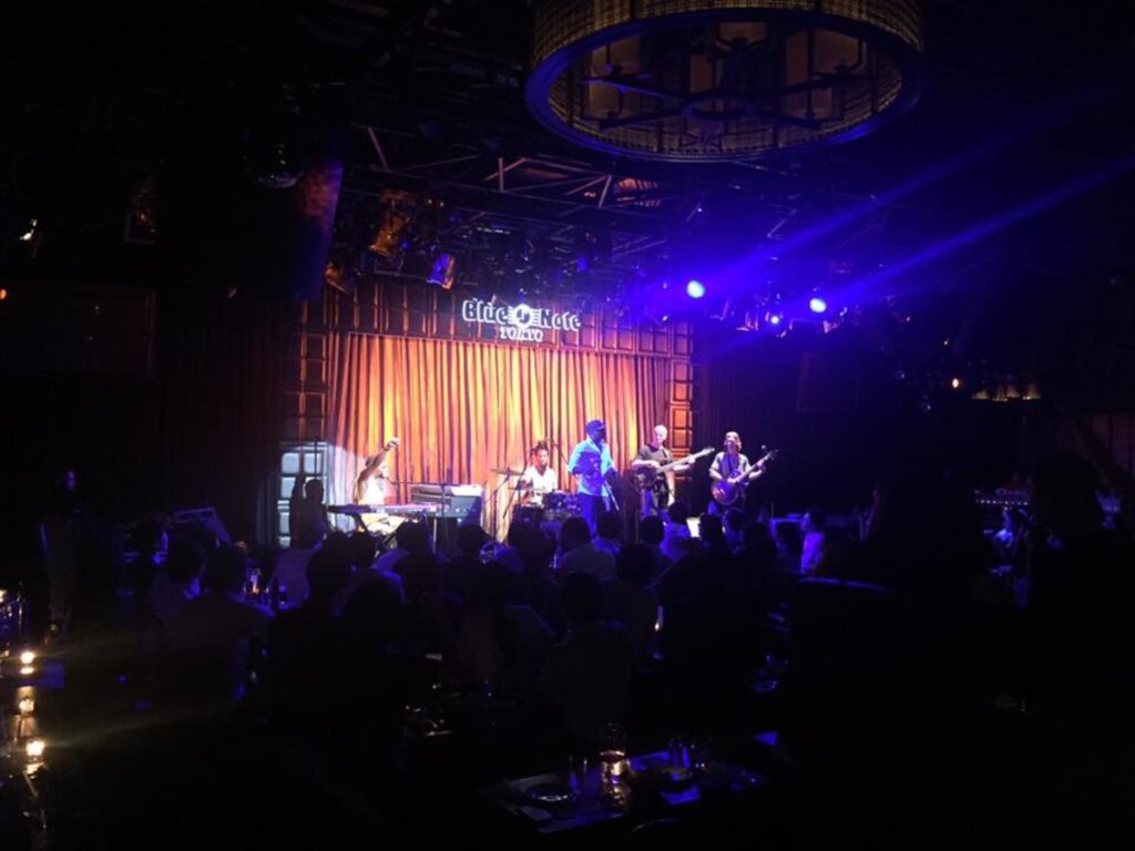 A band performing on stage at Blue Note Tokyo
