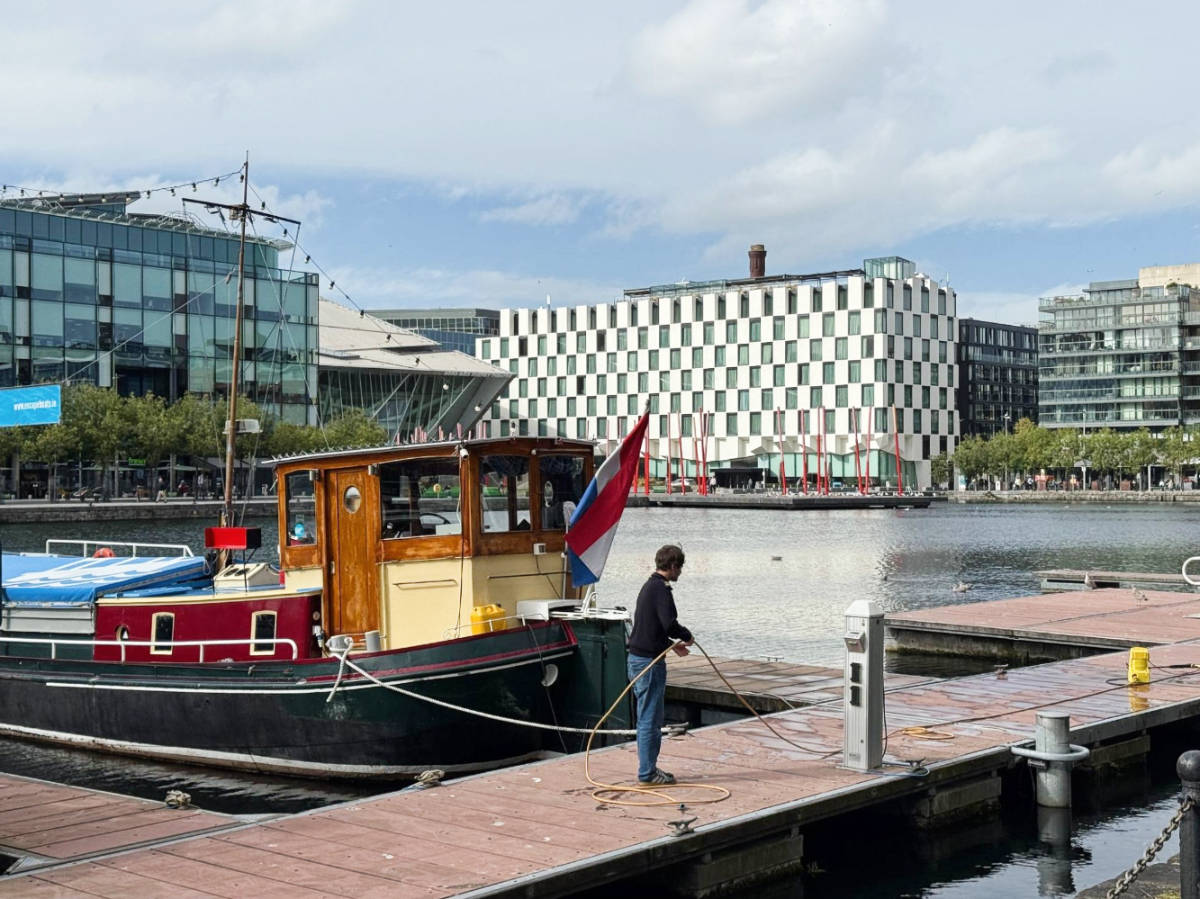 A boat being tie on a dock at the canal