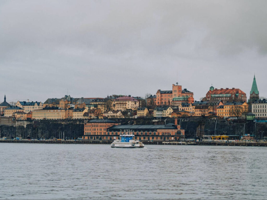 A boat with the panoramic view of the skyline of Stockholm