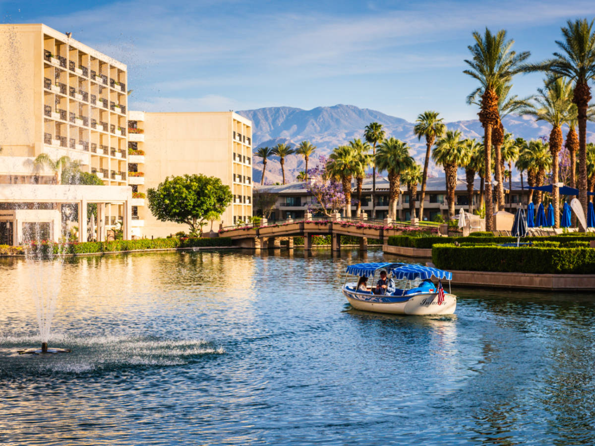A couple riding a boat at JW Marriott Desert Springs Resort and Spa