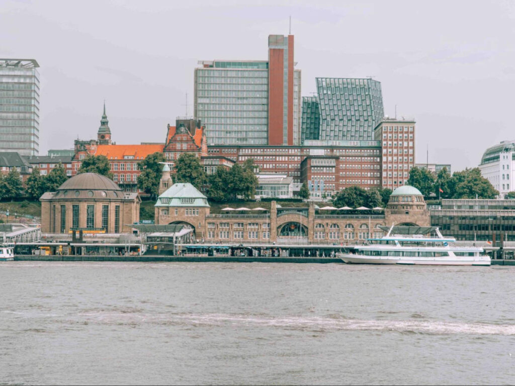 View of the city skyline and a boat crossing the Elbe