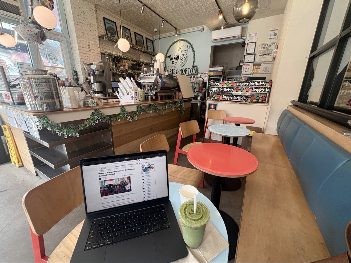 Working on a laptop with a cup of matcha at Boris & Horton Cafe