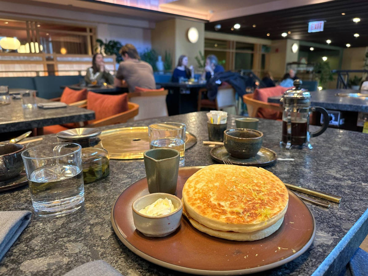 Pancakes and butter on a plate served in Perilla