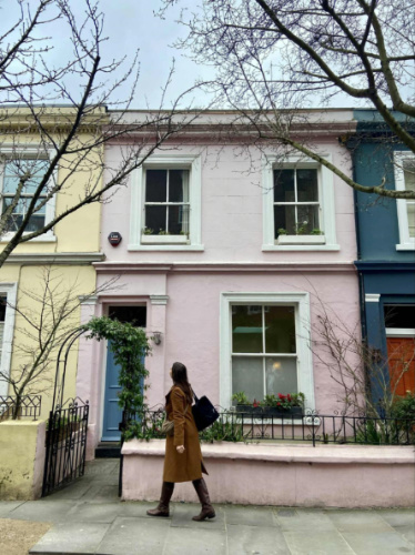 The author Brooke Horrobin, admiring the colorful architecture in Notting Hill