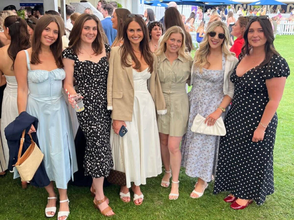 The author Brooke Horrobin and her friends, smiling for a photo at the Chestertons Polo in the Park