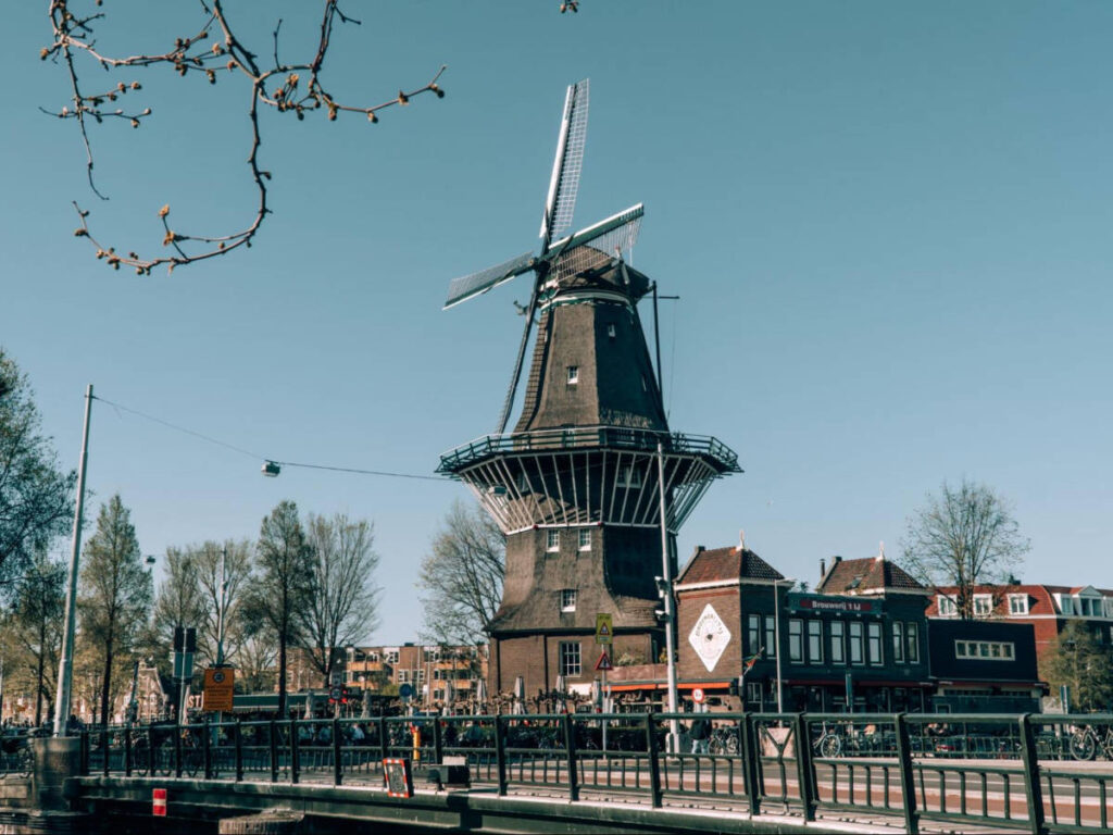 View of the Brouwerij ‘t IJ’s Mill with a clear blue sky in the background