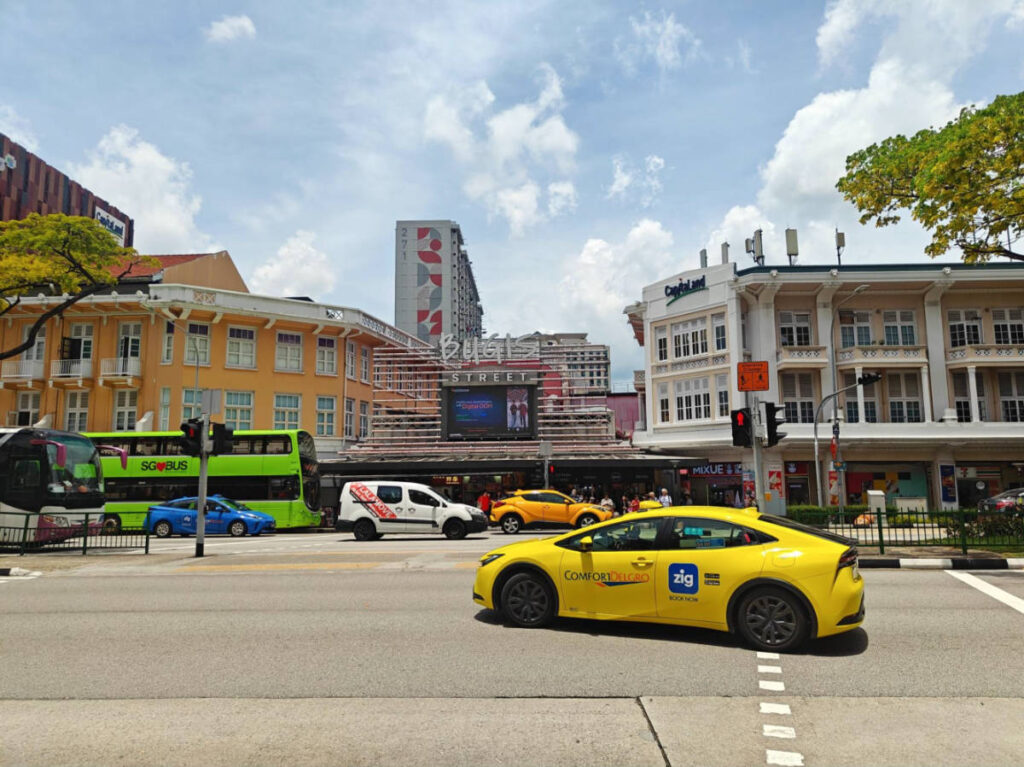 View of the Ccabs and buses along the streets in the Bugis neighborhood