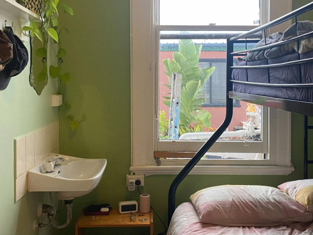 View of a sink and bunk bed on a room