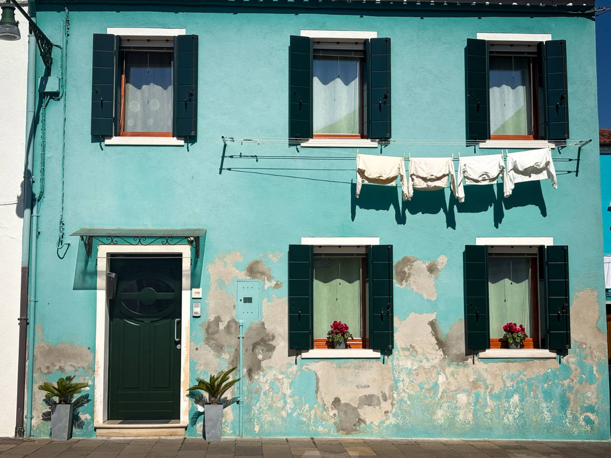 The exterior of the mint colored home in Burano
