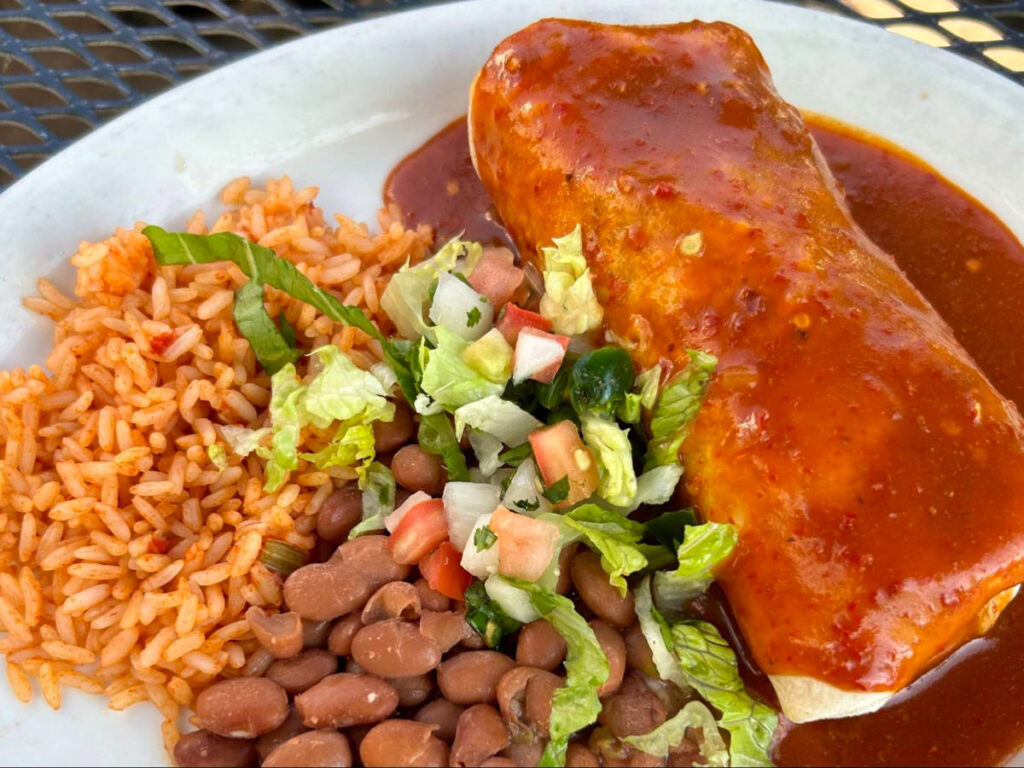 A plate of Smothered burritos at La Cueva Cafe