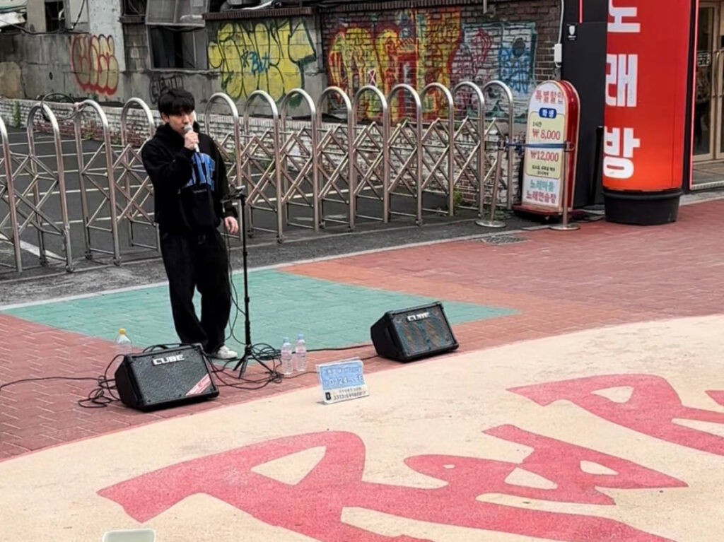 A man busking along Hongdae Red Road