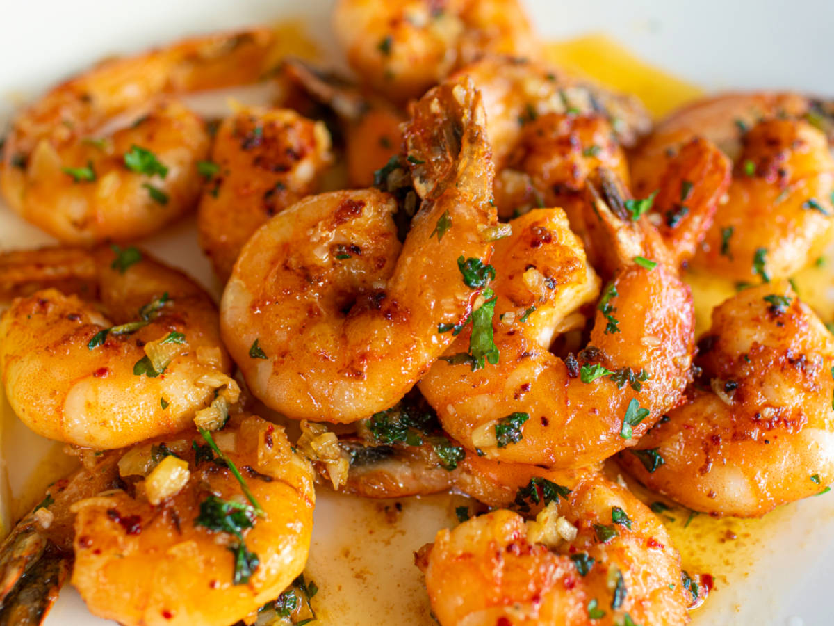 Close up shot of Pan fried butter garlic shrimp on plate