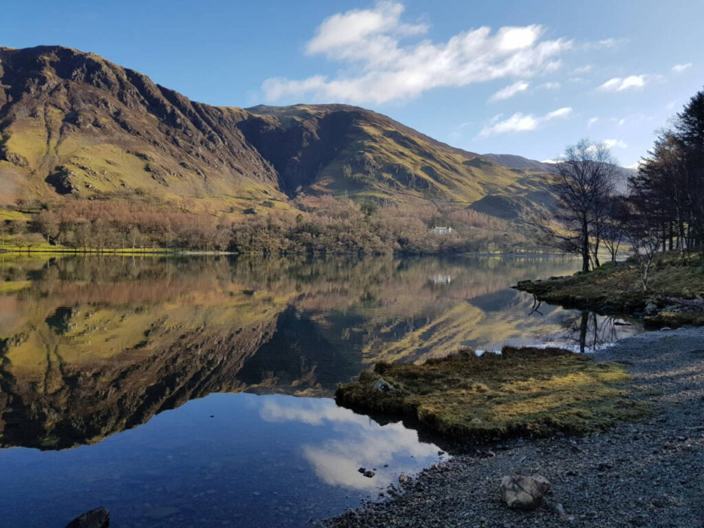 Scenic mountain views reflecting on the water in Buttermere