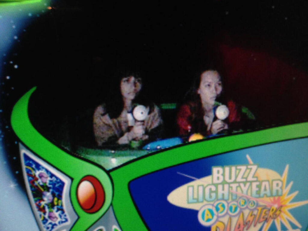 The author, McKenna Mobley with a friend at the Buzz Lightyear Astro Blasters