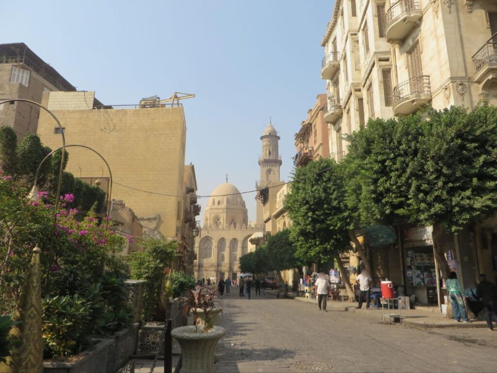 Street in Cairo with a mosque in the background
