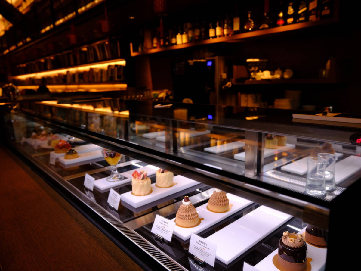 View of the cakes in the display rack at the hotel cafe