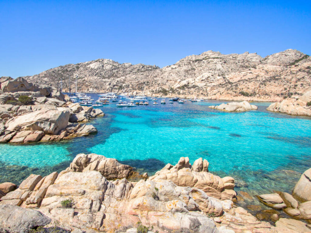 View of the turquoise blue water and clear sky of Cala Coticcio