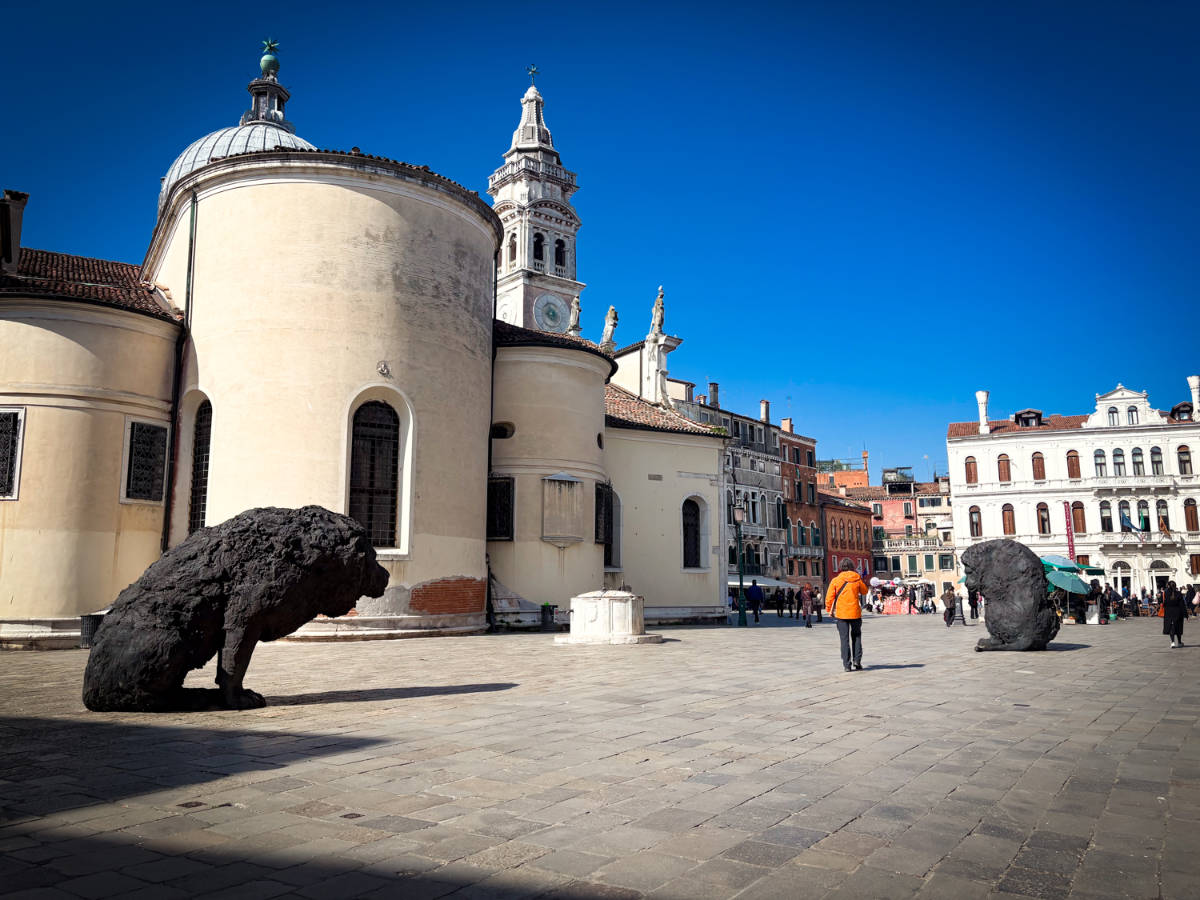 View of the white painted buildings and lion sculptures around the Campo Santa Maria Formosa