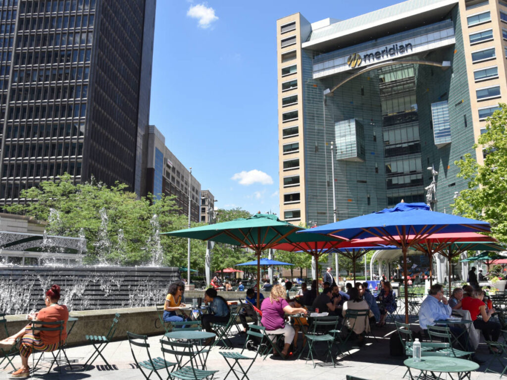 People relaxing with the skyline views in Campus Martius Park